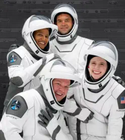 A group photo of Inspiration Four's Crew in their space suits.